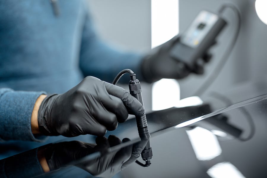 Measuring paint cover thickness of the car body at the service